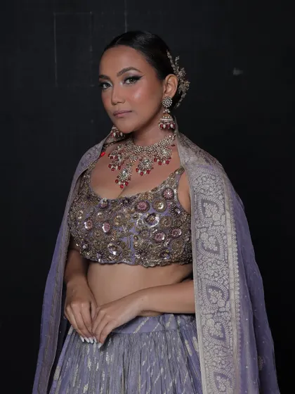 A mid-shot showing how the necklace sits with the neckline of the blouse.