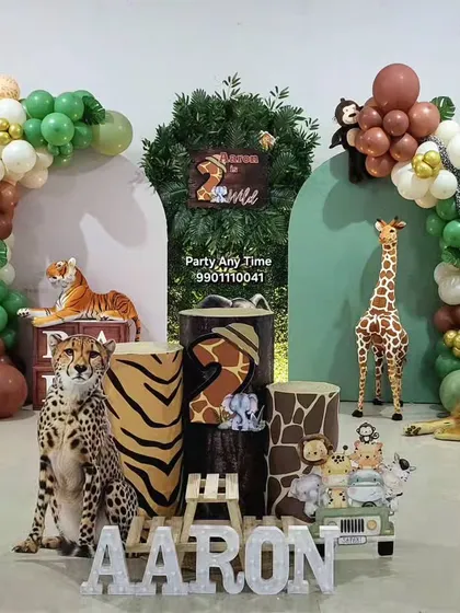 A full view of the "Aaron" jungle party setup, showing how all the elements like balloons, backdrops, and props come together.
