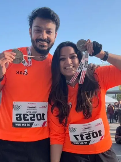 A couple from our tribe celebrating their finish at the Honda Manesar Half Marathon. We run and win together.