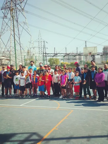 A group photo of all participants and winners from our inter-society basketball matches. It's about community and competition.