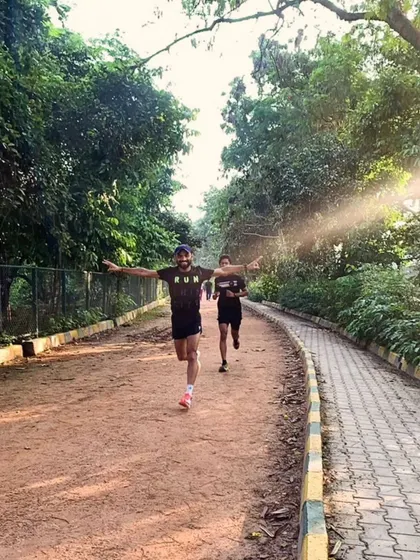 That feeling of accomplishment with arms outstretched after a tough run. We celebrate the effort and the journey.
