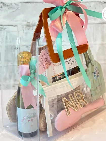 This clear tote bag is a modern and practical way to package a bridesmaid hamper, allowing all the beautiful, personalized gifts inside to be seen.