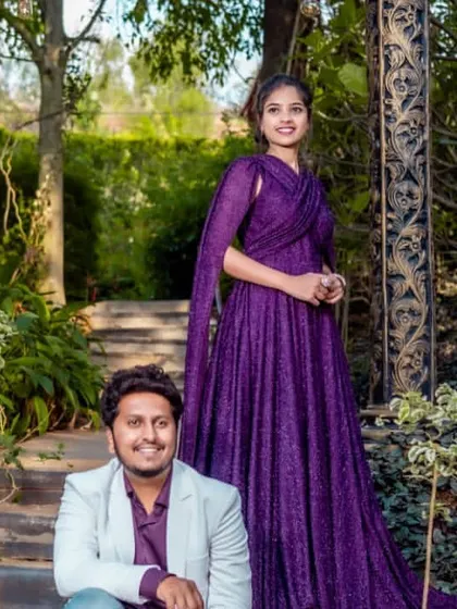 A romantic shot of the couple. The groom's outfit is simple yet stylish, complementing the bride's grand gown.