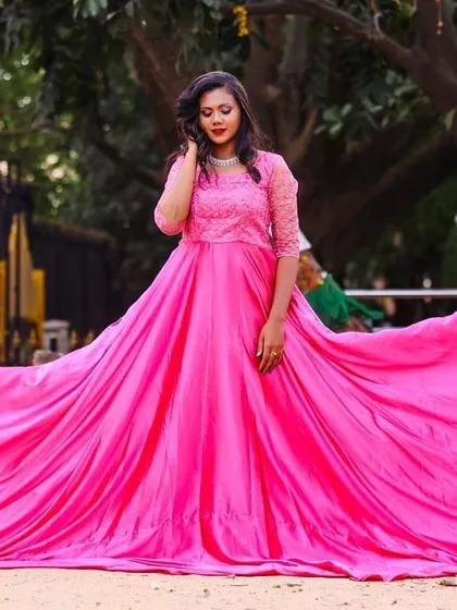My flowing pink photoshoot gown is one of my most requested rental items for pre-wedding and maternity shoots. The long, dramatic trail creates incredible photos, and the vibrant color looks amazing against any backdrop. This is how you get those fairytale pictures without buying an expensive dress.