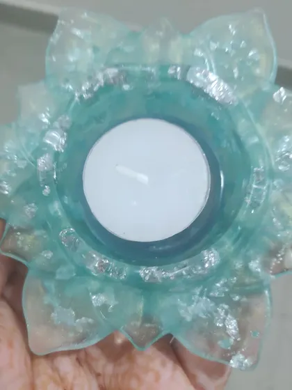 A simple and elegant lotus T-light holder. I made this one with a translucent light blue resin and mixed in silver flakes for a delicate, frosty look.