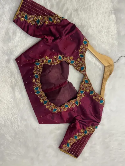 A beautiful custom blouse with a unique color combination of wine and teal.