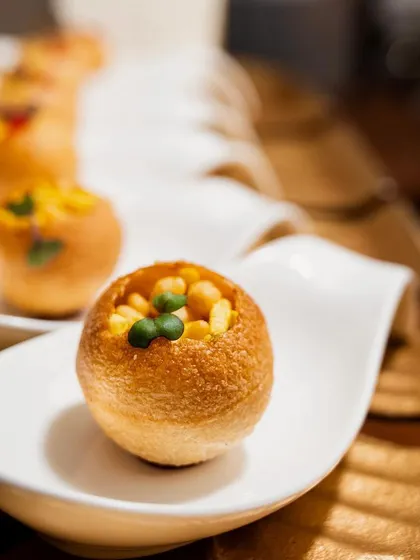 A modern take on a classic street food favorite. Our Mini Rajkachori Pop canapés are individually served for a clean, elegant, and flavorful experience.