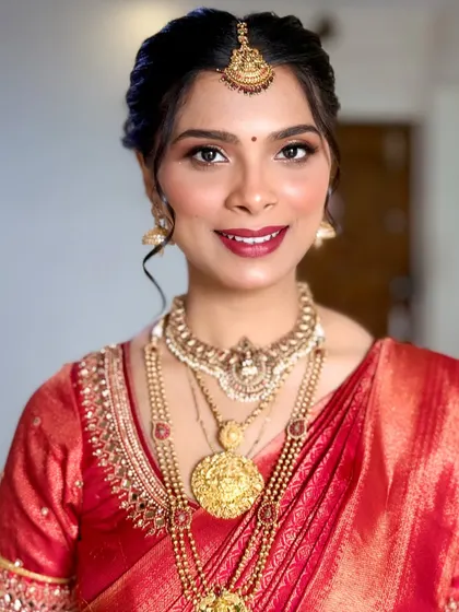 A radiant South Indian bride. This portrait highlights the flawless base makeup and the beautiful, healthy glow of her skin.