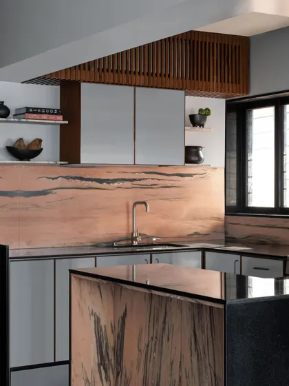 Another view of the kitchen I designed for a restaurateur, highlighting the pink Makrana marble. The custom cabinetry and island are designed for serious cooking and entertaining.