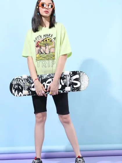 Another shot of the "Let's Make a Trip" outfit, showcasing the full look with the skateboard as a key accessory.