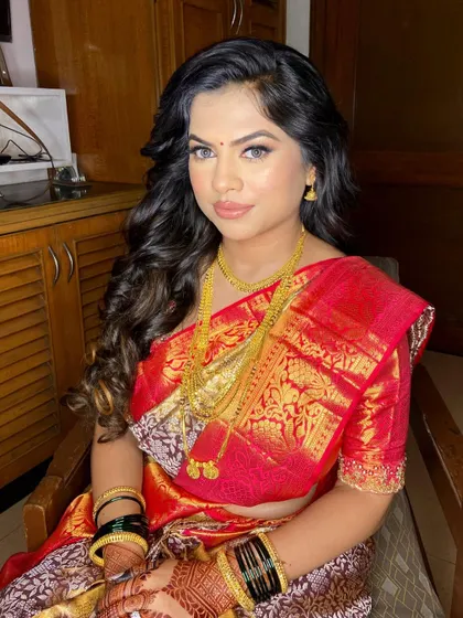 Engagement ready in a traditional red saree. This Maharashtrian look is classic and beautiful, with a focus on clean makeup and traditional jewelry.