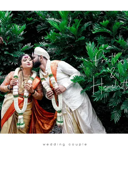 A beautiful portrait of the couple in a garden setting, the groom's tender kiss and the bride's happy expression making a perfect wedding memory.