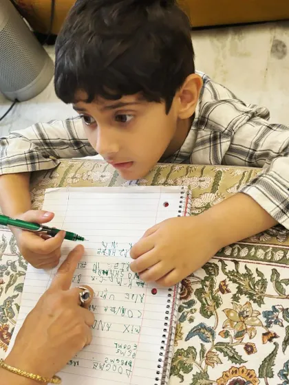 My nephew Amartya, the inspiration for the 'Cook & Keep' journal, carefully taking down a recipe from his nani. This is what passing down traditions looks like.