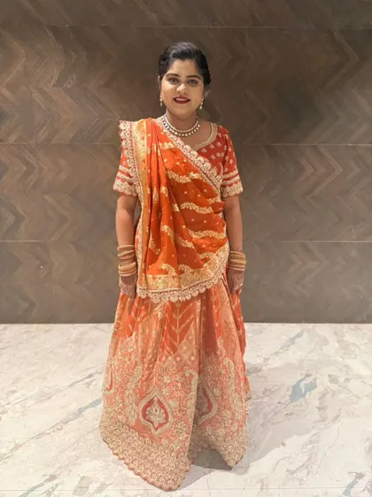 Here is one of my happy clients looking radiant in our rented orange and red bandhani style lehenga. It’s perfect for a wedding guest or even for a bride's smaller function.