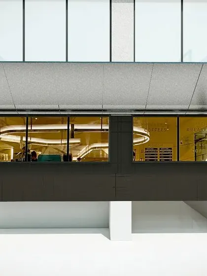 A 3D render of the facade concept, visualizing the tilted canopy and its relationship to the building.