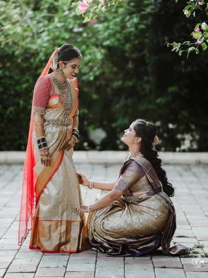A sweet moment between the bride and her sister or bridesmaid, sharing a look of love and support on the wedding day.