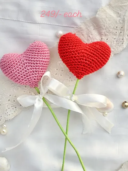 Simple, sweet, and straight from the heart. These crochet heart flowers are a perfect way to say "I love you" and are available in both pink and red.
