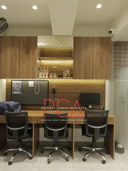 The shared workstation area at StyleIn Homes, designed for efficiency and collaboration with ample desk space and integrated storage.