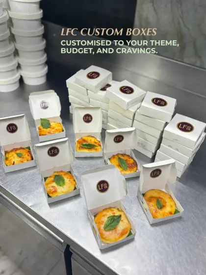 My custom boxes can be tailored to your specific needs. Here, you can see individual portions of baked pasta in custom branded mini boxes, showcasing a great option for corporate events or personalized party favors.