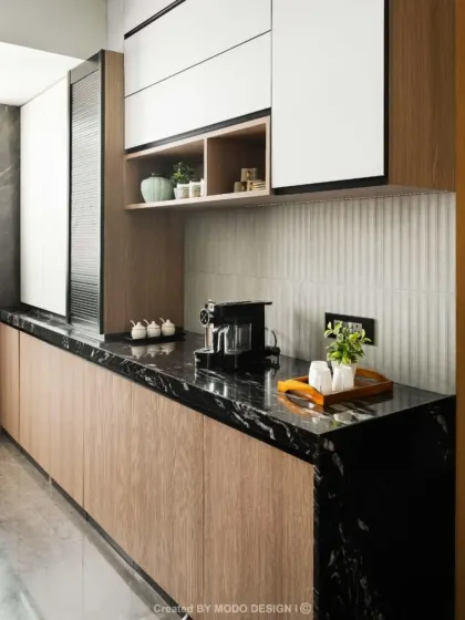 Here, we focused on creating spacious counters for effortless prep and smart storage to keep everything organized. The black marble countertop provides a durable and stylish surface for daily use.
