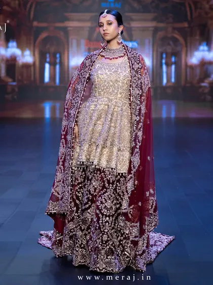 A full view of the Gold and Maroon Indo-Western ensemble, a masterpiece that blends tradition and modern glam.