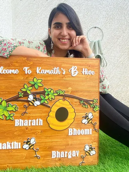 Here I am with a large, custom "B Hive" nameplate made for a family. This piece was so much fun to create, with buzzing bees and a honeycomb detail to welcome everyone to the Kamath's hive.