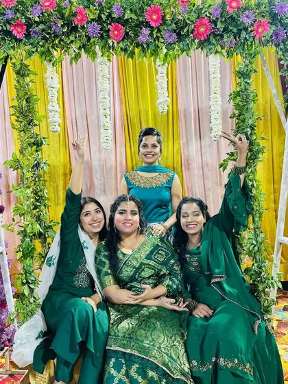 The bride tribe having fun on the floral swing. Creating these picture-perfect spots is key to ensuring the wedding is filled with memorable and shareable moments.