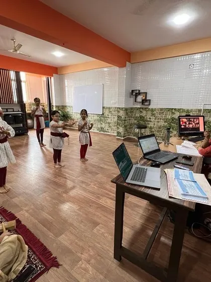 A view from behind the instructor's desk, showing how we manage our integrated online and offline classes seamlessly.