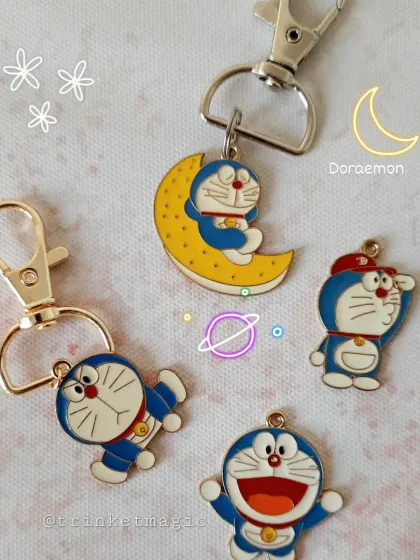 Everyone's favorite robotic cat, Doraemon. I have a variety of Doraemon enamel charms, including one of him sleeping on the moon. So cute.