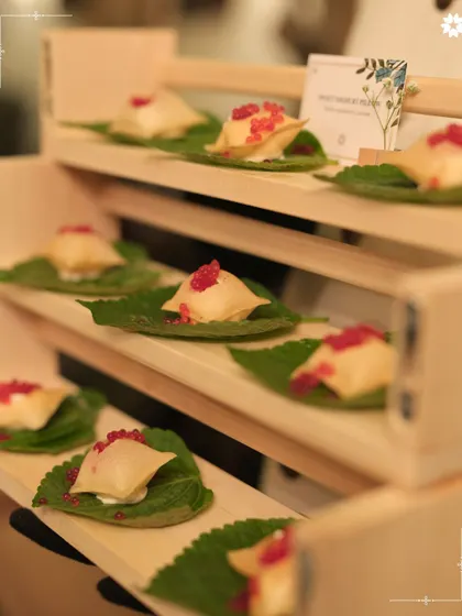 Delicate parcels topped with pomegranate seeds, served on individual leaves. This appetiser showcases our attention to detail and our love for creating beautiful, bite sized art.