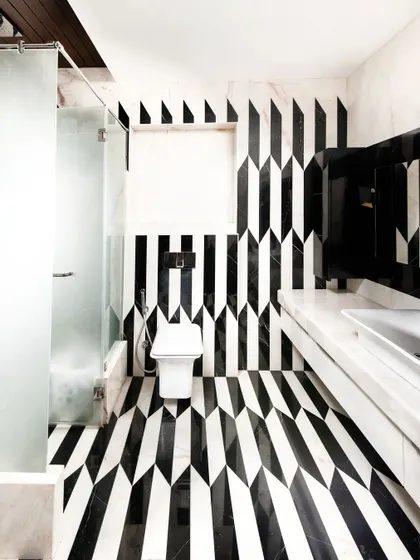We believe in the power of detail. This bathroom, with its bold marble inlay work, shows our commitment to craftsmanship and creating moments of unexpected beauty. It’s an example of how even the most functional spaces can be transformed into art through thoughtful material selection and execution.