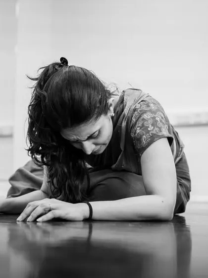 A moment of exhaustion and surrender in rehearsal for *Abandhana*. The process of embodying these ancient stories is physically and emotionally demanding, but incredibly rewarding.