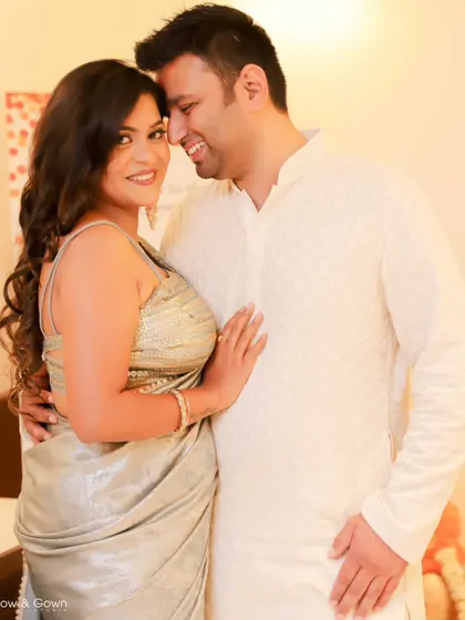 The colour version of a lovely Roka ceremony portrait. The couple looks radiant and happy as they pose together.