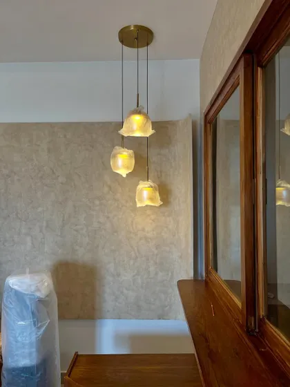 This pendant light cluster is judging your boring ceiling fan. We believe in mood lighting over harsh overhead glare every time.