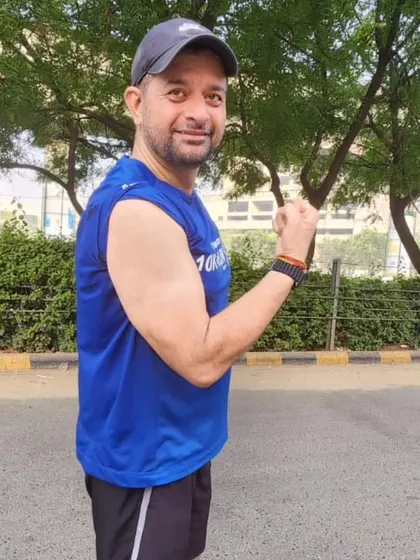 A warrior showing his bicep after a tough workout. We build strength, not just endurance.