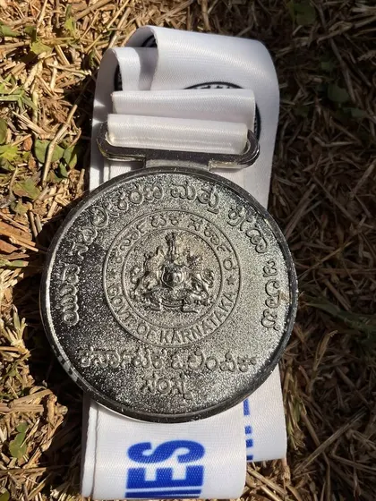 A close-up of the silver medal from the Netball State Games 2025, a symbol of the hard work and dedication of our athletes.