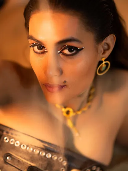 A "Jet Black Vibes" concept shoot I directed and styled. I used a black-on-black theme with a leather corset, turban, and dramatic, crystal-studded eye makeup to create a powerful and mysterious editorial look.