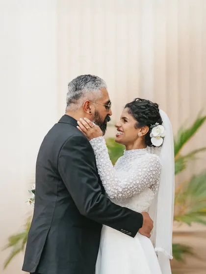 A beautiful, candid moment between a bride and her father. Their shared look of love and happiness is a touching tribute to the bond they share on her wedding day.
