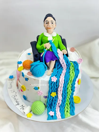A cake for a mom who loves knitting, ordered by her son for her leap year birthday. The design features an edible caricature and colorful balls of yarn.