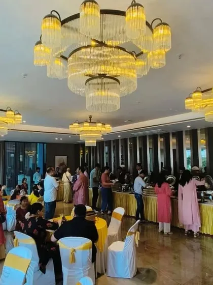 From intimate parties to large-scale events for 300+ guests, we handle it all. This image captures the grand atmosphere of a house warming ceremony we catered at Lodha WhiteCity, showcasing the full dining experience.