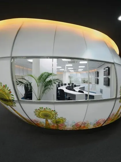 The "Egg". This pod meeting room was one of our first uses of stretch fabric to create a sculptural skin. It sits within the open office as a functional art piece.