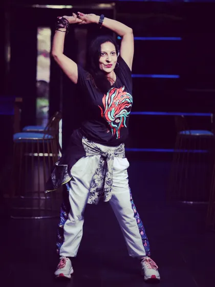 Posing during a promotional shoot. I believe great dancers are defined by their passion, and I pour my heart into every performance.