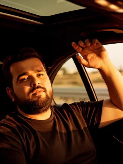 A candid style shot from inside a luxury car during a photoshoot. Capturing the feeling of a smooth ride.