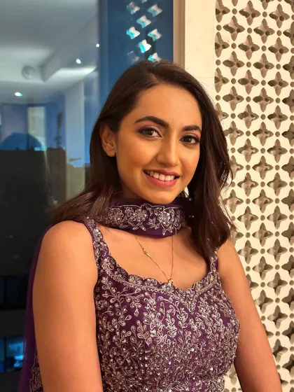 This client's joyful smile says it all. The makeup is designed to make her feel confident and beautiful as she celebrates with her family.