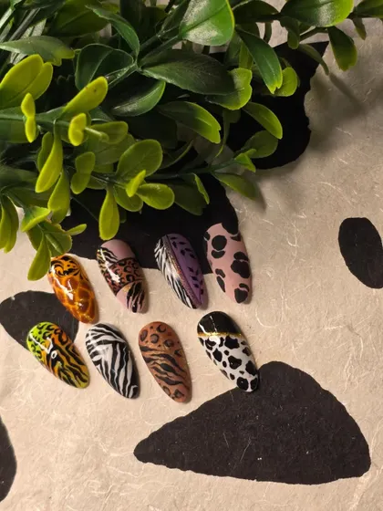 More examples of animal print nail art. Notice the different color combinations and variations, from classic brown leopard to pink dalmatian, that you can create.