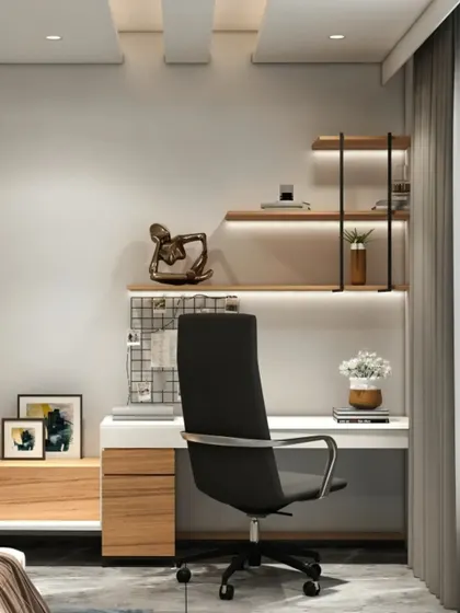 A minimalist and clean home office setup. The design features a simple white desk with wood drawers and floating shelves with integrated lighting, creating an uncluttered and calming workspace.