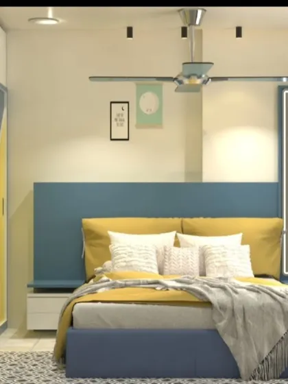 A vibrant kids' room in blue and yellow, with a geometric pattern on the wardrobe doors.