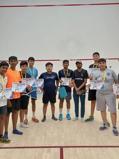 Our junior players proudly displaying their participation certificates after competing in a SWYNG squash event.