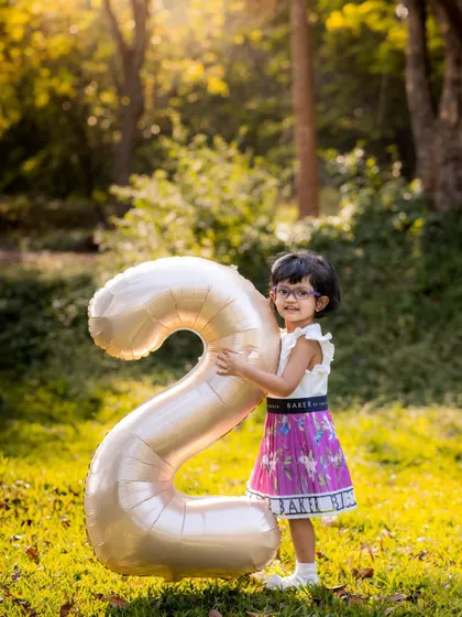 Turning two is a big deal. A simple outdoor session with a number balloon is a classic and beautiful way to mark the milestone.