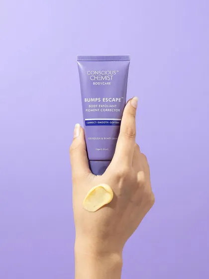 A simple hand model shot that showcases the product and its texture. The swatch on the back of the hand gives a realistic idea of the product's consistency, while the purple background makes the packaging pop.